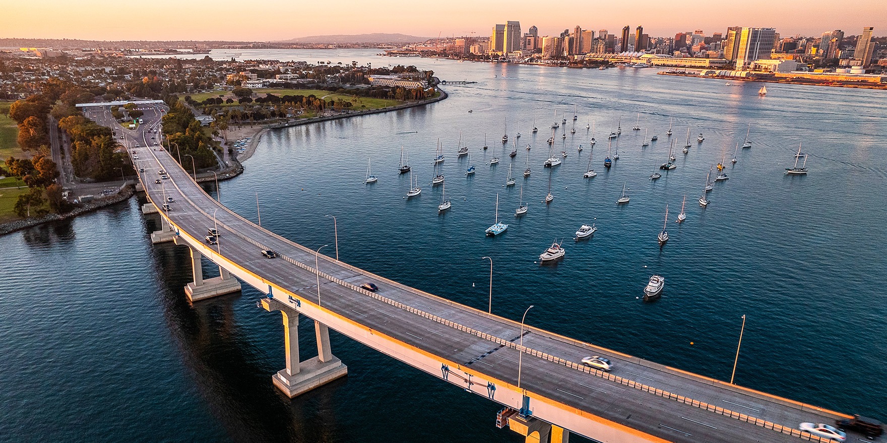 Beautiful picture of San Diego with sail boats lined up in the water