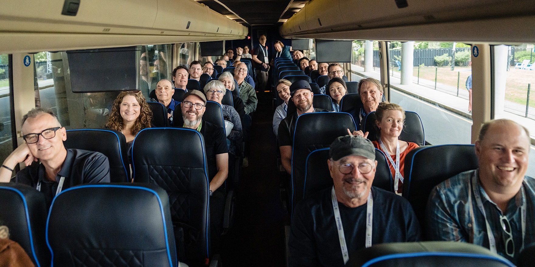 Attendees on bus for an exclusive architect-led tour