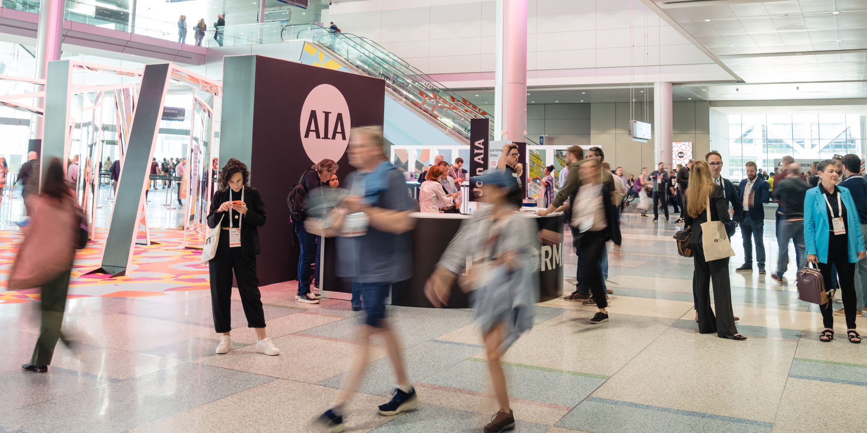 Attendees walking through lobby at AIA conference